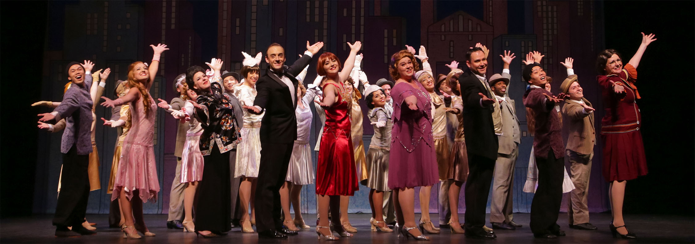 Photo of the performers bowing at the end of our 2015 production of Thoroughly Modern Millie.