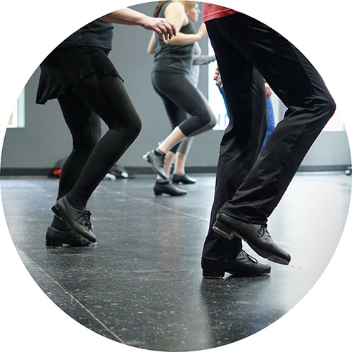 Photo from one of our adule tap classes, showing a low angle of our students' feet as they practice.