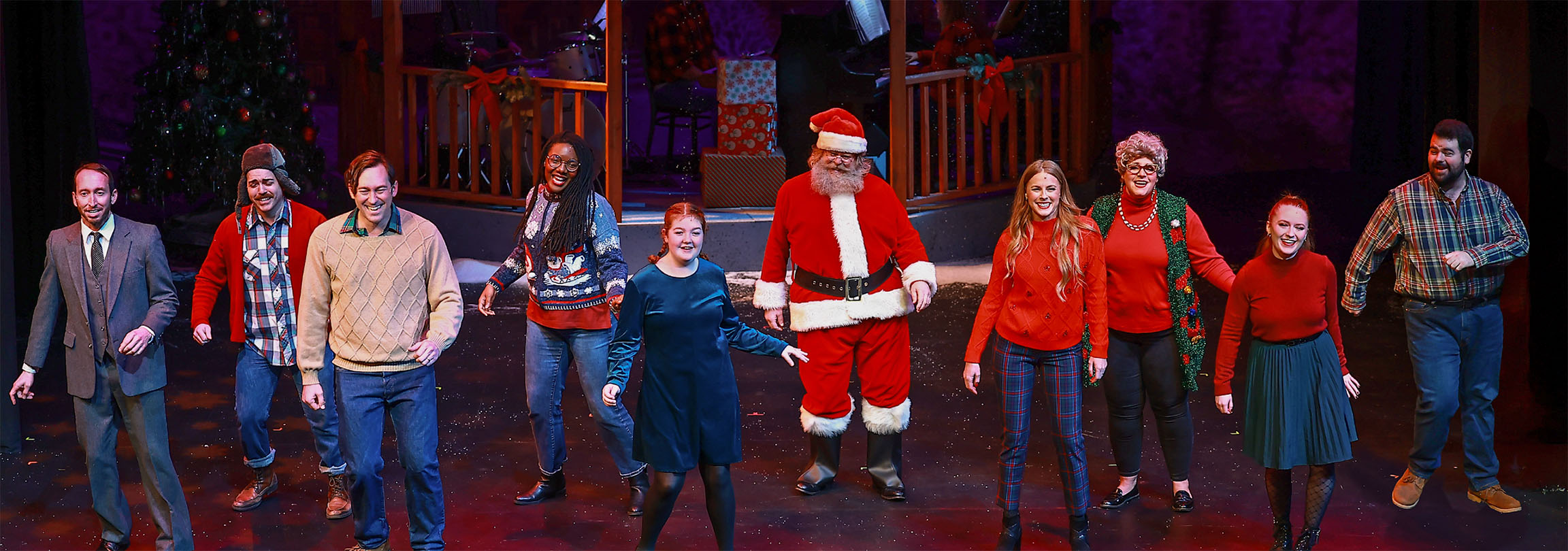 Photo of the cast of Five Golden Rings, spread across the stage during the closing number, singing and dancing together.