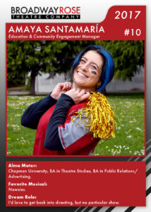A sports card with a photo of Amaya Santamaria in a football jersey with gold pom poms over her shoulders. The text on the card reads: Alma Mater: Chapman University, BA in Theatre Studies, BA in Public Relations and Advertising. Favorite Musical:Newsies. Dream Role: I'd love to get back into directing, but no particular show.
